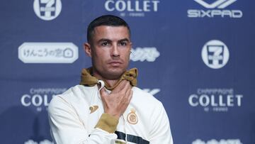 Al-Nassr's Cristiano Ronaldo adjusts his clothing during a press conference in Osaka on July 23, 2023. Saudi Arabia's Al-Nassr are in Japan to play friendly matches against France's Paris Saint-Germain and Italy's Inter Milan. (Photo by PAUL MILLER / AFP)