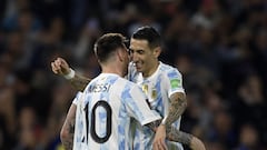 Argentina's Lionel Messi (L) celebrates with Argentina's Angel Di Maria after scoring against Venezuela during their South American qualification football match for the FIFA World Cup Qatar 2022 at La Bombonera stadium in Buenos Aires on March 25, 2022. (Photo by JUAN MABROMATA / AFP)