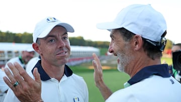 FARMINGDALE, NEW YORK - SEPTEMBER 28: Rory McIlroy of Team Europe and caddie Shay Knight celebrate during the Sunday singles matches of the 2025 Ryder Cup at Black Course at Bethpage State Park Golf Course on September 28, 2025 in Farmingdale, New York. Richard Heathcote/Getty Images/AFP (Photo by Richard HEATHCOTE / GETTY IMAGES NORTH AMERICA / Getty Images via AFP)