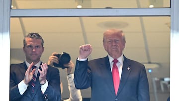 LANDOVER, MARYLAND - NOVEMBER 09: United States Secretary of Defense Pete Hegseth claps while U.S. President Donald Trump holds up his fist during a game between the Detroit Lions and the Washington Commanders at Northwest Stadium on November 09, 2025 in Landover, Maryland. Greg Fiume/Getty Images/AFP (Photo by Greg Fiume / GETTY IMAGES NORTH AMERICA / Getty Images via AFP)