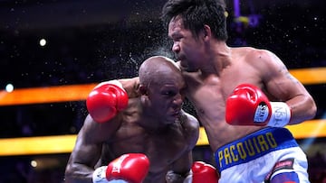 Aug 21, 2021; Las Vegas, Nevada; Manny Pacquiao (right) fights Yordenis Ugas in a world welterweight championship bout at T-Mobile Arena. Mandatory Credit: Stephen R. Sylvanie-USA TODAY Sports     TPX IMAGES OF THE DAY