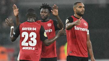 Bayer Leverkusen's French forward #23 Nordi Mukiele, Bayer Leverkusen's Burkinabe defender #12 Edmond Tapsoba and Bayer Leverkusen's German defender #04 Jonathan Tah rects after the German Cup (DFB Pokal) 2nd round football match between Bayer 04 Leverkusen and SV Elversberg in Leverkusen, western Germany on October 29, 2024. (Photo by INA FASSBENDER / AFP) / DFB REGULATIONS PROHIBIT ANY USE OF PHOTOGRAPHS AS IMAGE SEQUENCES AND QUASI-VIDEO.
