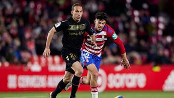 GRANADA, SPAIN - FEBRUARY 10: Victor Meseguer of Granada CF competes for the ball with Nacho Martinez of CD Tenerife during the LaLiga Smartbank match between Granada CF and CD Tenerife at Estadio Nuevo Los Carmenes on February 10, 2023 in Granada, Spain. (Photo by Fermin Rodriguez/Quality Sport Images/Getty Images)