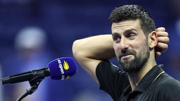 Serbia's Novak Djokovic speaks during an interview after winning the men's singles quarterfinal tennis match against USA's Taylor Fritz on day ten of the US Open tennis tournament at the USTA Billie Jean King National Tennis Center in New York City, on September 2, 2025. (Photo by CHARLY TRIBALLEAU / AFP)