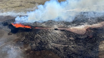 FILE PHOTO: Lava spurts and flows after the eruption of a volcano in the Reykjanes Peninsula, Iceland, July 12, 2023, as seen in this handout picture taken from a Coast Guard helicopter. Civil Protection of Iceland/Handout via REUTERS THIS IMAGE HAS BEEN SUPPLIED BY A THIRD PARTY MANDATORY CREDIT/File Photo
