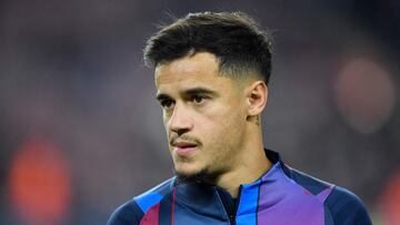 (FILES) In this file photo taken on December 18, 2021 Barcelona's Brazilian midfielder Philippe Coutinho warms up before the Spanish league football match between FC Barcelona and Elche CF at the Camp Nou stadium in Barcelona. - FC Barcelona announce