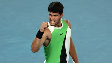 Spain's Carlos Alcaraz reacts on a set point to Australia's Alex De Minaur during their men's singles quarter-final match on day ten of the Australian Open tennis tournament in Melbourne on January 27, 2026. (Photo by Martin KEEP / AFP) / -- IMAGE RESTRICTED TO EDITORIAL USE - STRICTLY NO COMMERCIAL USE --