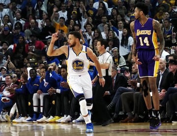 Steph Curry celebrates landing a basket for the Golden State Warriors.