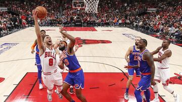 Oct 28, 2021; Chicago, Illinois, USA; Chicago Bulls guard Zach LaVine (8) goes to the basket against New York Knicks center Mitchell Robinson (23) during the second half at United Center. Mandatory Credit: Kamil Krzaczynski-USA TODAY Sports
