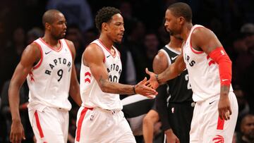 Jan 8, 2018; Brooklyn, NY, USA; Toronto Raptors shooting guard DeMar DeRozan (10) reacts with small forward CJ Miles (0) after hitting the game tying shot against the Brooklyn Nets during overtime at Barclays Center. Mandatory Credit: Brad Penner-USA TODAY Sports