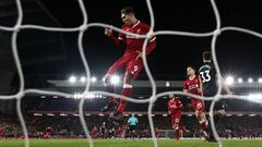 Roberto Firmino scores against Swansea at Anfield.