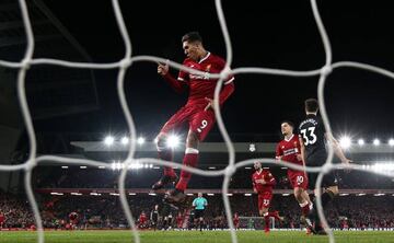 Roberto Firmino scores against Swansea at Anfield.