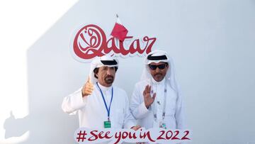 Two men pose for a picture in the Majlis Qatar pavilion in Moscow's Gorky Park in Moscow on July 12, 2018.
Qatar will host of the FIFA World Cup in 2022. / AFP PHOTO / Maxim ZMEYEV