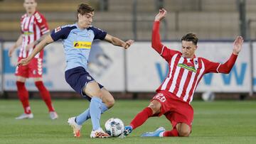 Neuhaus, frente a Koch.