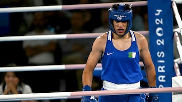 Algeria's Imane Khelif (Blue) prepares to fight Thailand's Janjaem Suwannapheng in the women's 66kg semi-final boxing match during the Paris 2024 Olympic Games at the Roland-Garros Stadium, in Paris on August 6, 2024. (Photo by Mauro PIMENTEL / AFP)