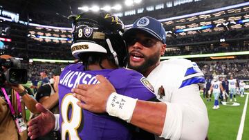 ARLINGTON, TEXAS - SEPTEMBER 22: Quarterback Dak Prescott #4 of the Dallas Cowboys hugs quarterback Lamar Jackson #8 of the Baltimore Ravens after agame at AT&T Stadium on September 22, 2024 in Arlington, Texas. Sam Hodde/Getty Images/AFP (Photo by Sam Hodde / GETTY IMAGES NORTH AMERICA / Getty Images via AFP)