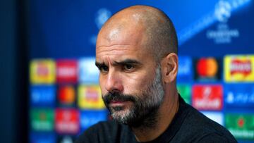 Pep Guardiola, manager of Manchester City looks on during a press conference ahead of the UEFA Champions League group C match against Celtic