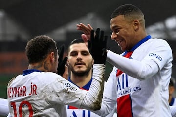 Paris Saint-Germain's Brazilian forward Neymar celebrates with French forward Kylian Mbappé.