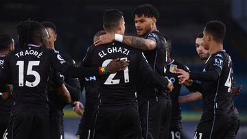 Aston Villa's Dutch striker Anwar El Ghazi (CL) celebrates with teammates after scoring his team's first goal during the English Premier League football match between Leeds United and Aston Villa at Elland Road in Leeds, northern England on Febr