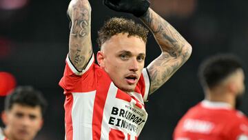 PSV Eindhoven's Dutch forward #10 Noa Lang celebrates his team's first goal during the UEFA Champions League knockout phase play-off 2nd leg football match between PSV Eindhoven and Juventus at the Philips Stadion in Eindhoven on February 19, 2025. (Photo by NICOLAS TUCAT / AFP)