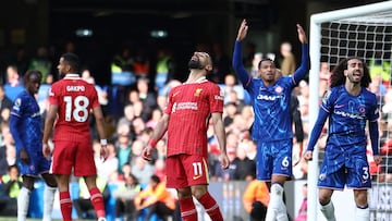 Liverpool's Egyptian striker #11 Mohamed Salah (C) reacts after missing a chance during the English Premier League football match between Chelsea and Liverpool at Stamford Bridge in London on May 4, 2025. (Photo by HENRY NICHOLLS / AFP) / RESTRICTED TO EDITORIAL USE. No use with unauthorized audio, video, data, fixture lists, club/league logos or 'live' services. Online in-match use limited to 120 images. An additional 40 images may be used in extra time. No video emulation. Social media in-match use limited to 120 images. An additional 40 images may be used in extra time. No use in betting publications, games or single club/league/player publications. /