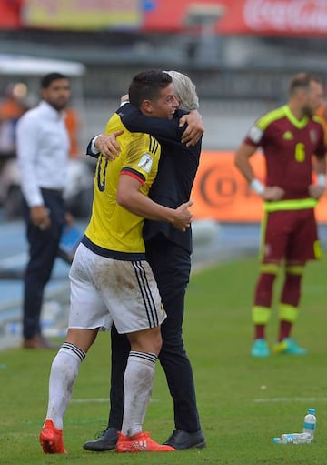 Colombia player James Rodriguez (L) and coach Jose Pekerman celebrate a goal against Venezuela during their 2018 FIFA World Cup qualifying football match at the Roberto Melendez stadium in Barranquilla