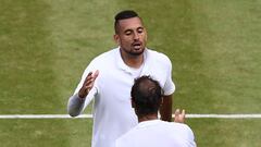 (FILES) In this file photo taken on July 4, 2019 Australia's Nick Kyrgios (top) shakes hands with Spain's Rafael Nadal (bottom) after Nadal won their men's singles second round match on the fourth day of the 2019 Wimbledon Championships at The All England Lawn Tennis Club in Wimbledon, southwest London. - Rafael Nadal and Nick Kyrgios will meet for a place in the Wimbledon final on July 8, 2022 in what the Australian star claims will be "the most watched tennis match ever." Nadal leads their series 6-3. AFP Sport looks at four of their most memorable matches in a rivalry which has been thrilling and often testy. (Photo by Daniel LEAL / AFP)