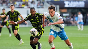 Aug 1, 2025; Columbus, Ohio, USA; Puebla forward Esteban Lozano (17) plays the ball against Columbus Crew defender Steven Moreira (31) in the first half at Lower.com Field. Mandatory Credit: Aaron Doster-Imagn Images
