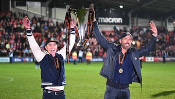 US actor and Wrexham owner Rob McElhenney (L) and US actor and Wrexham owner Ryan Reynolds (R) celebrate