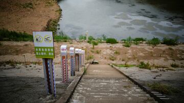 Water level poles emerge after waters receded in a reservoir amid hot temperatures, while many regions from southwest to east of the country along the Yangtze river have been experiencing weeks of record-breaking heatwave in Changxing, Zhejiang province, China, August 20, 2022. REUTERS/Aly Song