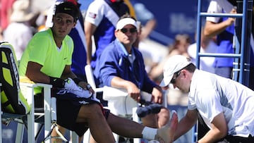 Rafa Nadal receives treatment on his left foot during a match against Mikhail Youzhny at the 2010 US Open.