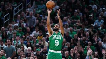 Oct 22, 2024; Boston, Massachusetts, USA; Boston Celtics guard Derrick White (9) shoots for three points against the New York Knicks in the first quarter at TD Garden. Mandatory Credit: David Butler II-Imagn Images
