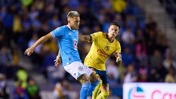 Gonzalo Piovi (L) of Cruz Azul fights for the ball with Brian Rodriguez (R) of America during the 6th round match between Cruz Azul and America as part of the Liga BBVA MX, Torneo Apertura 2024 at Ciudad de los Deportes Stadium on August 31, 2024 in Mexico City, Mexico.