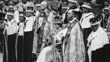 2nd June 1953:  Queen Elizabeth II seated upon the throne at her coronation in Westminster Abbey, London.  She is holding the royal sceptre (ensign of kingly power and justice) and the rod with the dove (symbolising equity and mercy).  (Photo by Topical Press Agency/Getty Images)