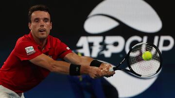 Roberto Bautista Agut of Spain hits a return to Nick Kyrgios of Australia in the men's singles match in the ATP Cup tennis tournament in Sydney on January 11, 2020. (Photo by Glenn Nicholls / AFP) / --IMAGE RESTRICTED TO EDITORIAL USE - NO COMMERCIAL USE--