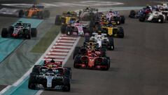 ABU DHABI, UNITED ARAB EMIRATES - NOVEMBER 25: Valtteri Bottas driving the (77) Mercedes AMG Petronas F1 Team Mercedes WO9 leads Sebastian Vettel of Germany driving the (5) Scuderia Ferrari SF71H on track during the Abu Dhabi Formula One Grand Prix at Yas Marina Circuit on November 25, 2018 in Abu Dhabi, United Arab Emirates.  (Photo by Charles Coates/Getty Images)