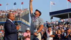 Bryson DeChambeau of the United States celebrates with the trophy as he is interviewed by NBC sportscaster Mike Tirico after winning the 124th U.S. Open at Pinehurst Resort on June 16, 2024 in Pinehurst, North Carolina.