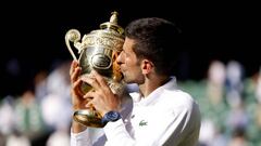 Novak Djokovic celebrates with the Trophy following his victory over Nick Kyrgios in The Final of the Gentlemen's Singles on day fourteen of the 2022 Wimbledon Championships at the All England Lawn Tennis and Croquet Club, Wimbledon. Picture date: Sunday July 10, 2022. (Photo by Steven Paston/PA Images via Getty Images)