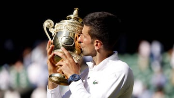Novak Djokovic celebrates with the Trophy following his victory over Nick Kyrgios in The Final of the Gentlemen's Singles on day fourteen of the 2022 Wimbledon Championships at the All England Lawn Tennis and Croquet Club, Wimbledon. Picture date: Sunday July 10, 2022. (Photo by Steven Paston/PA Images via Getty Images)
