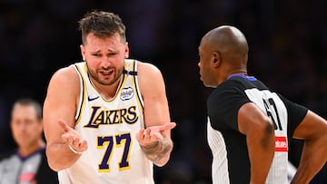 Mar 22, 2025; Los Angeles, California, USA; Los Angeles Lakers guard Luka Doncic (77) reacts to a call from referee Courtney Kirkland (61) against the Chicago Bulls during the second half at Crypto.com Arena. Mandatory Credit: Jonathan Hui-Imagn Images
