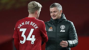Soccer Football - Premier League - Manchester United v West Bromwich Albion - Old Trafford, Manchester, Britain - November 21, 2020 Manchester United manager Ole Gunnar Solskjaer and Donny van de Beek celebrate at the end of the match Pool via REUTERS/Mar