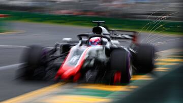 MELBOURNE, AUSTRALIA - MARCH 24: Sparks fly behind Romain Grosjean of France driving the (8) Haas F1 Team VF-18 Ferrari on track during qualifying for the Australian Formula One Grand Prix at Albert Park on March 24, 2018 in Melbourne, Australia.  (Photo by Mark Thompson/Getty Images)