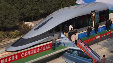 People visit a prototype magnetic levitation train developed with high-temperature superconducting (HTS) maglev technology at the launch ceremony in Chengdu, in southwestern China&#039;s Sichuan province on January 13, 2021. (Photo by STR / AFP) / China O