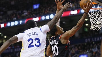 Jan 13, 2018; Toronto, Ontario, CAN; Toronto Raptors guard DeMar DeRozan (10) goes up to make a basket as Golden State Warriors forward Draymond Green (23) defends at the Air Canada Centre. Golden State defeated Toronto. Mandatory Credit: John E. Sokolowski-USA TODAY Sports