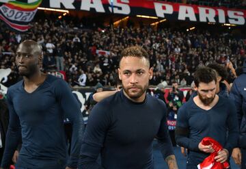 (From L) Paris Saint-Germain's Portuguese midfielder Danilo Pereira, Paris Saint-Germain's Brazilian forward Neymar and Paris Saint-Germain's Argentine forward Lionel Messi react as they leave the pitch after losing the first leg of the UEFA Champions League round of 16 football match between Paris Saint-Germain (PSG) and FC Bayern Munich at the Parc des Princes stadium in Paris on February 14, 2023. (Photo by FRANCK FIFE / AFP)