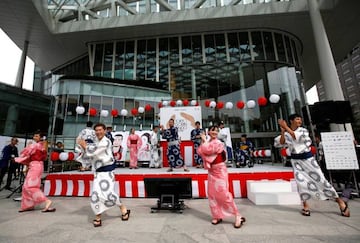 Dancers, athletes and television celebrities perform a new version of the Tokyo 1964 Olympic Games "Tokyo Gorin Ondo", during today's event.