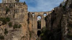 Spanish base-jumper Dani Roman wearing a wingsuit crosses the main arc of the New Bridge in Ronda on November 30, 2022. (Photo by JORGE GUERRERO / AFP) (Photo by JORGE GUERRERO/AFP via Getty Images)