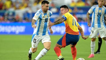 Argentina's forward #10 Lionel Messi fights for the ball with Colombia's midfielder #10 James Rodriguez during the Conmebol 2024 Copa America tournament final football match between Argentina and Colombia at the Hard Rock Stadium, in Miami, Florida on July 14, 2024. (Photo by JUAN MABROMATA / AFP) (Photo by JUAN MABROMATA/AFP via Getty Images)