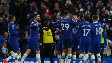 Chelsea's English midfielder Mason Mount (rear C) celebrates with teammates after scoring his team second goal during the English Premier League football match between Chelsea and Bournemouth at Stamford Bridge in London on December 27, 2022. (Photo by Ian Kington / AFP) / RESTRICTED TO EDITORIAL USE. No use with unauthorized audio, video, data, fixture lists, club/league logos or 'live' services. Online in-match use limited to 120 images. An additional 40 images may be used in extra time. No video emulation. Social media in-match use limited to 120 images. An additional 40 images may be used in extra time. No use in betting publications, games or single club/league/player publications. / 