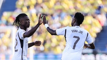 Real Madrid's Brazilian forward #07 Vinicius Junior celebrates with Real Madrid's French midfielder #12 Eduardo Camavinga after scoring his team's first goal during the Spanish league football match between UD Las Palmas and Real Madrid CF at the Gran Canaria stadium in Las Palmas de Gran Canaria on January 27, 2024. (Photo by Thomas COEX / AFP)